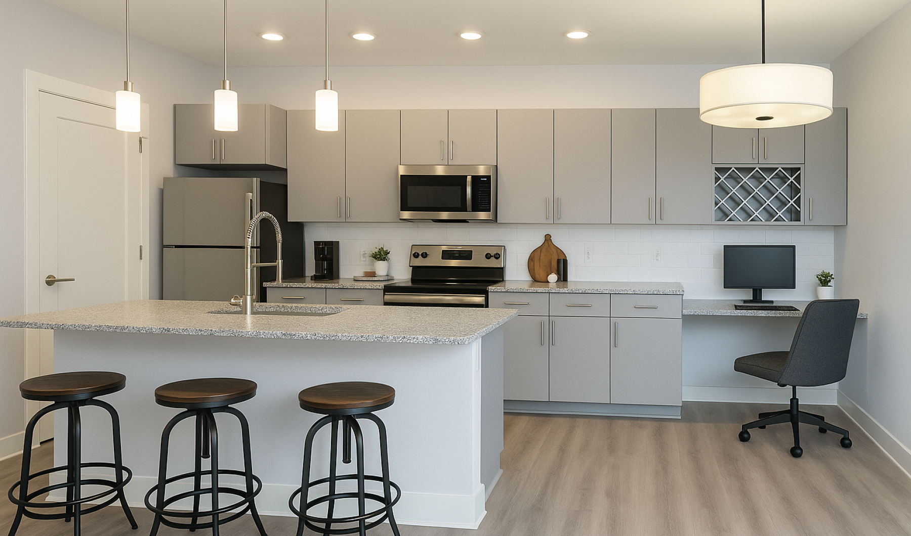 Camby apartments with modern kitchens Staged apartment kitchen with island and desk