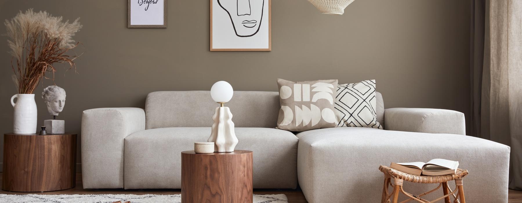 a couch with a table and a stool in front of it