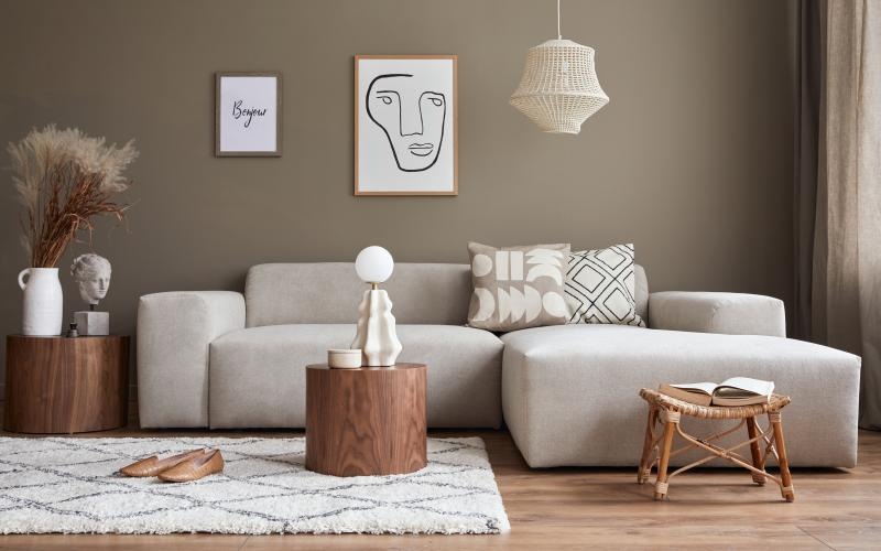 a couch with a table and a stool in front of it